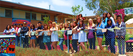 University City High School’s Power of One Participates in their garden.