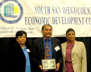 Outstanding Corporate Citizen Award Outstanding Corporate Citizen Award - (L to R: South County EDC President Rosa Lopez-Gonzalez, Dukie Valderama, Ileana Ovalle of Cox Communications