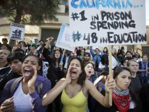 Students sit outside Covel Commons, site of the UC Regents meeting. Photos provided by Rudy Acuña
