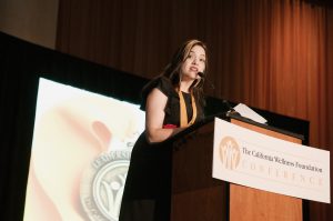 Perla at the podium