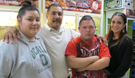 Antonio Martinez, second from left, with father Francisco, sister Jessica (left) and family friend Melissa Mejia (right). Photo by Mark R. Day