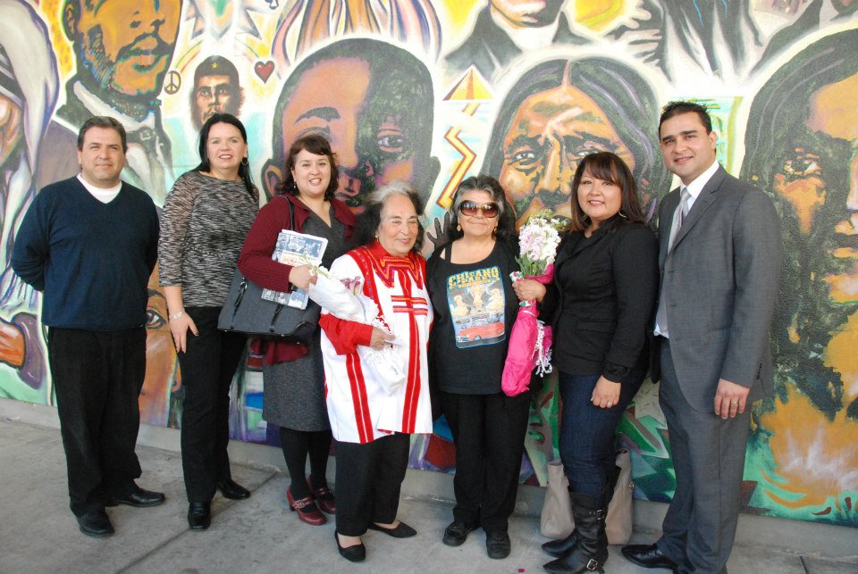 Gracia Molina de Pick (center with flowers) surrounded by Mesa College professors. Lefto to right: Professor Manuel Velez, Professor Victoria Chavez, Dionne Espinoza, Ph.D., Professor, CSULA,Gracia Molina de Pick, Community Activist Tommie Camarillo, Patricia Aguayo, Chicana Artist, and Professor Cesar Lopez, Ph.D.