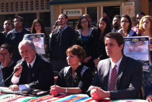Armando Navarro (holding microphone) and student leaders from UCR AIR discuss the immigration reform summit at a Feb. 22 press conference.