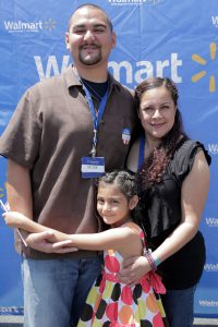 Mark Galindo, Sam’s Club employee and veteran, poses with his family at a community-wide event on Saturday, May 18 to honor veterans and those currently serving.  