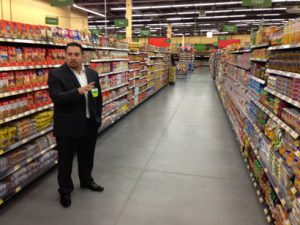 Walmart Neighborhood Market Store Manager Luciano Villela gives a media tour of the Sherman Heights store. Here he is in the Hispanic products aisle.