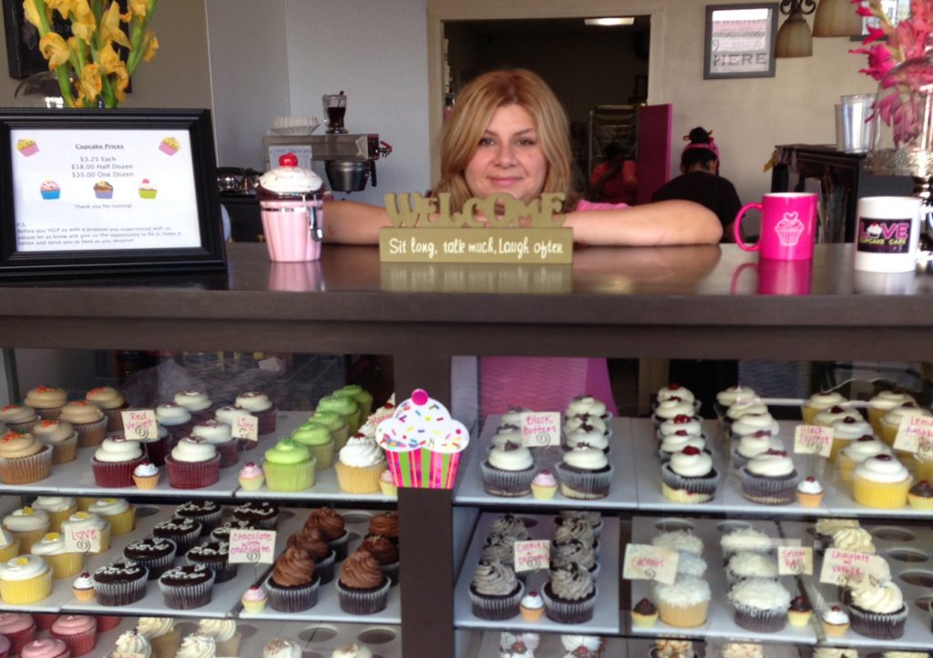 Love Cupcake Café owner, Hortenssia Zatarain, celebrating her 65,000 cupcake sold.