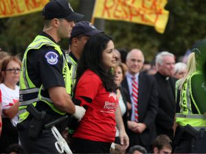 Brenda Perez of Nashville, Tenn. is arrested on First Street after protesters marched to the Capitol Tuesday. Perez was part of a group of three activists from Workers Dignity from Nashville who were arrested for civil disobedience. SHFWire photo by Andrés Rodríguez