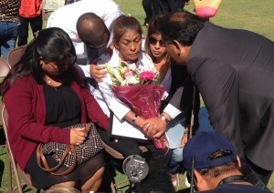 Maria Cordova, mother of Jennifer Moreno receives condolences from members of the Logan Heights community. 