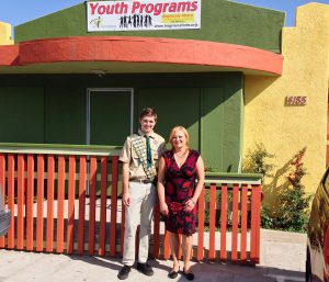 Zara Marselian, Chief Executive Officer of La Maestra Community Health Centers and Eagle Scout Derek Fisher in front of the newly completed railing system for the La Maestra Foundation Generations Teen Center After-School Program.