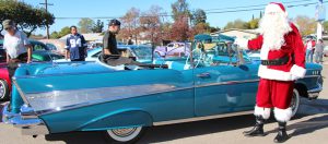 No respectable Santa would arrive at a Lowrider Toy Drive in anything less than a Chevy. This year Santa was Rob Rice from Majestics Car Club. 