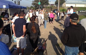 San Ysidro parents gather to hear their councilman, David Alvarez, before they begin their walk to push for a safe pathway for students along Otay Mesa Road.