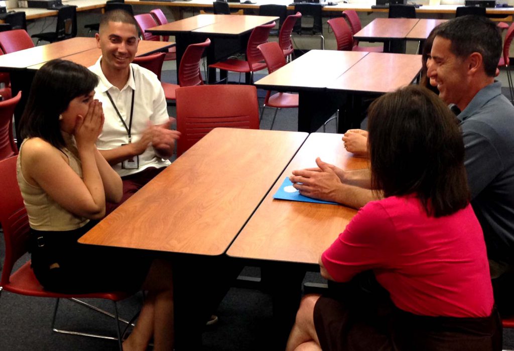 Castle Park High School Junior Norma Varela reacts to news she has received a $2,000 sponsorship through A Bridge for Kids. 