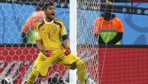 Argentina's goalkeeper Sergio Romero celebrates after saving a penalty kick by Ron Vlaar of the Netherlands during the penalty shootout in their 2014 World Cup semi-finals at the Corinthians arena in Sao Paulo July 9, 2014. REUTERS/Michael Dalder