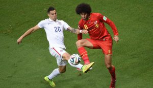 Belgium's midfielder Marouane Fellaini (R) and US defender Geoff Cameron vie for the ball during a Round of 16 football match between Belgium and USA at Fonte Nova Arena in Salvador during the 2014 FIFA World Cup on July 1, 2014. AFP PHOTO / PEDRO UGARTE