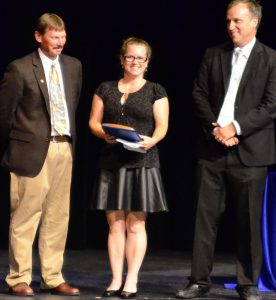 Marine Machinery Mechanic Deborah Fulbright (center) accepts her Apprentice of the Year award.
