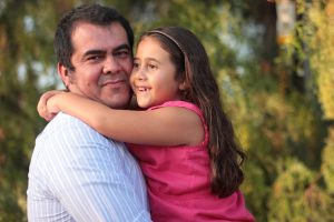 Candidate Adrian Arancibia with one of his daughters.