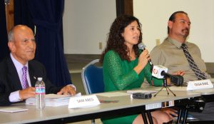 Deputy Mayor Olga Diaz, center, with Mayor Sam Abed, left, and Stephan Siaw to the right. Photo Credit: Hector Ericksen 