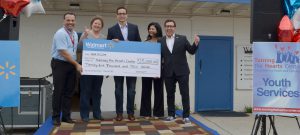 Turning the Hearts Center in Chula Vista receives $25,000 from Walmart to expand operations of Hearts for the Hungry Food Distribution Center. Pictured from left to right: Turning the Hearts Center Executive Director Marc Lovato, Chula Vista Mayor Cheryl Cox, Walmart Director of Public Affairs Philip Serghini, Turning the Hearts Center Board Member MaryAnn Ramirez, Turning the Hearts Center Board Chair Sergio De La Mora.
