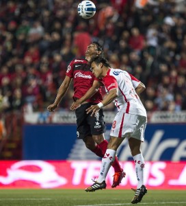 Alferdo Moreno for Club Xolo goes for a header.