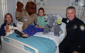 Sheriff’s deputies and McGruff the Crime Dog at a previous Teddy Bear Drive presentation at Rady Children’s Hospital.
