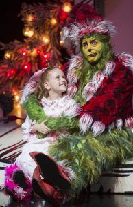 Taylor Coleman as Cindy-Lou Who and Burke Moses as The Grinch in the 17th annual production of Dr. Seuss' How the Grinch Stole Christmas!, directed by James Vásquez. The annual holiday musical runs Nov. 15 - Dec. 27, 2014 at The Old Globe. Photo by Jim Cox.