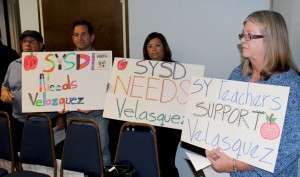 Erika Cueto, second from left, along with other teachers support the appointment of Ed Velasquez