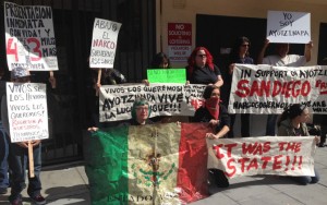 Community members show support for Ayotzinapa families in front of the Mexican Consulate in San Diego before a march last February. 