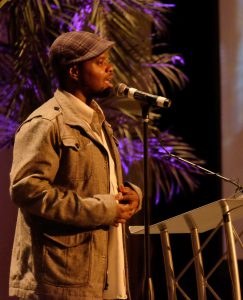 Mr. Sotu performing an original spoken word piece at the Jacobs Center’s Town Hall Series Launch in February.