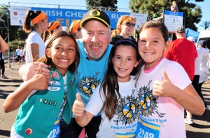 Chula Vista Girl Scout Junior Troop 6412 participated in the 5th annual Finish Chelsea’s Run, co-hosted by Girl Scouts San Diego. Left to right: Girl Scouts Maddy, Victoria and Jaden had the opportunity meet Chelsea’s parents, Kelly (in background) and Brent King (posing with girls).