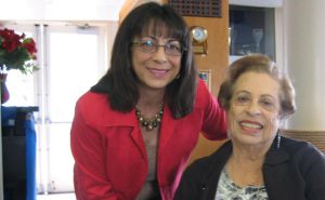Rosa, a dedicated research participant since 1997 with her beautiful smile at the Hispanic Open House/ Thank You Luncheon, pictured with Frances Goodrich.