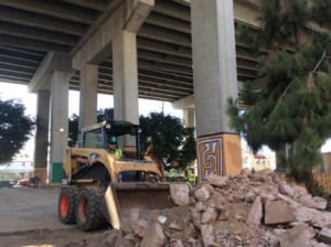 Urban Corp member, Alfredo Silva on the BobCat